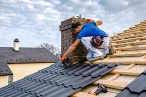 A homeowner and inspector examining shingles on a residential roof during a clear day.