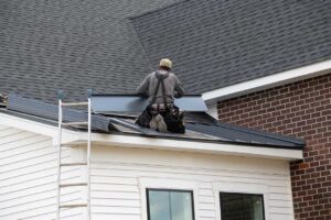 Homeowner using binoculars to inspect a shingle roof for storm damage from the ground after rainfall.